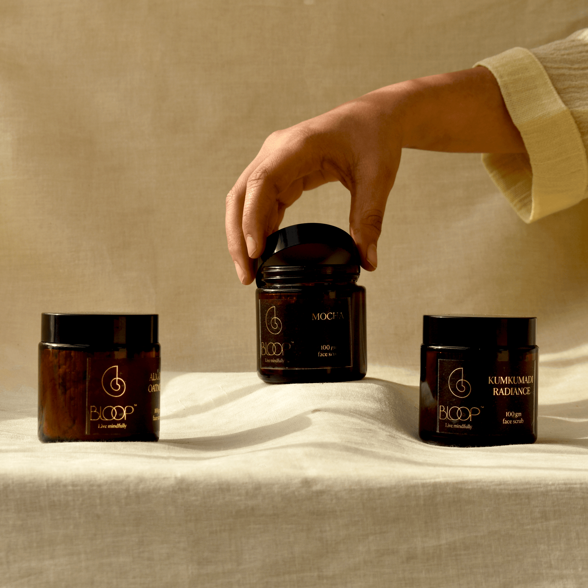 Elegant flat lay of Bloop Face Scrubs with clean, minimal background