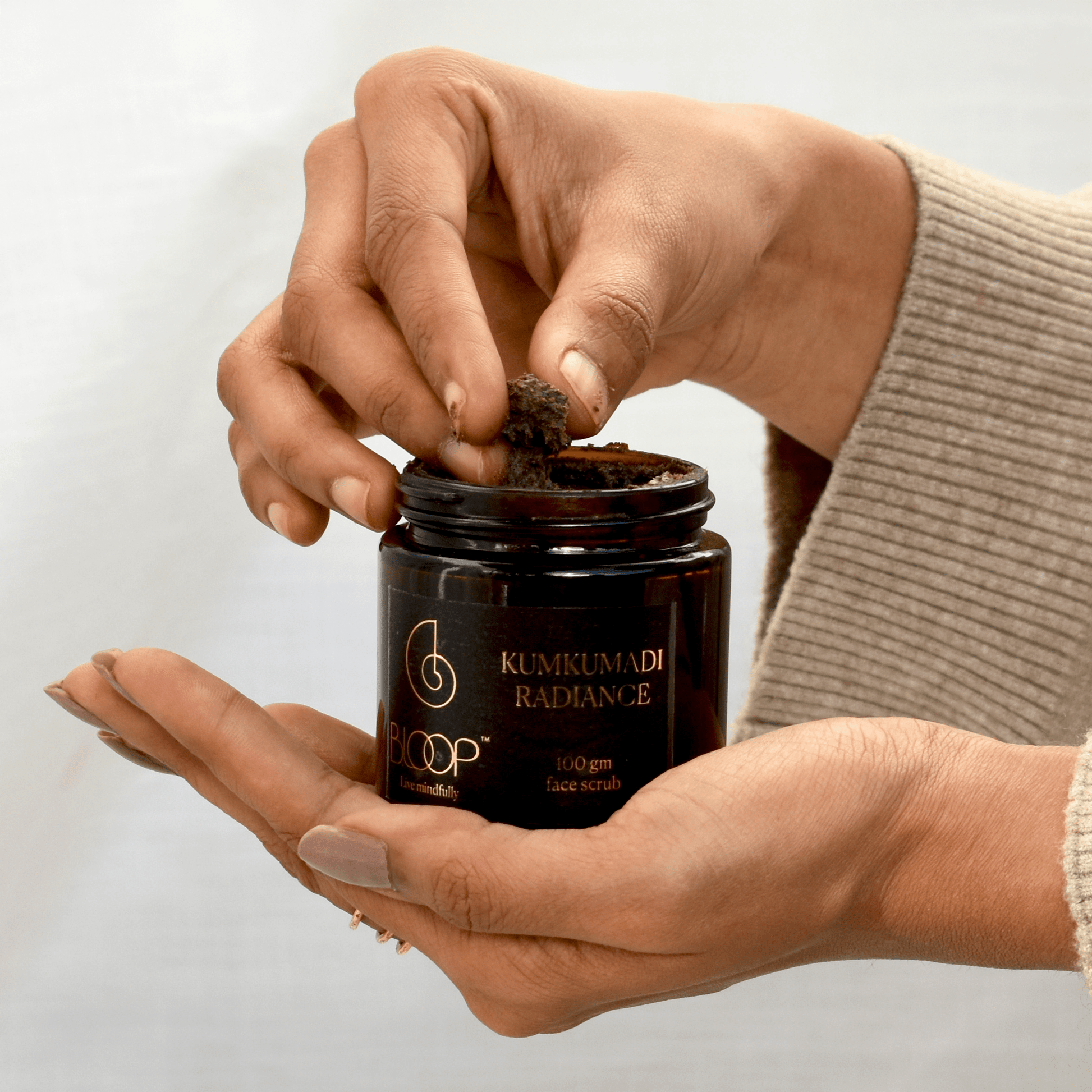 Grainy, natural texture of Bloop Kumkumadi Radiance Face Scrub with saffron-infused richness
